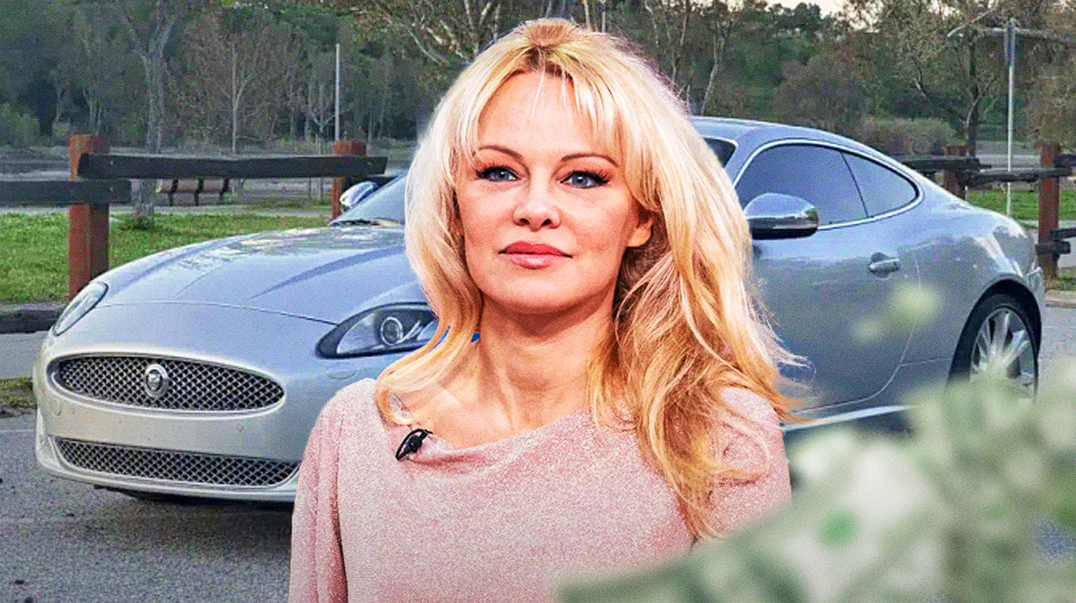 Pamela Anderson in front of a car from her collection.