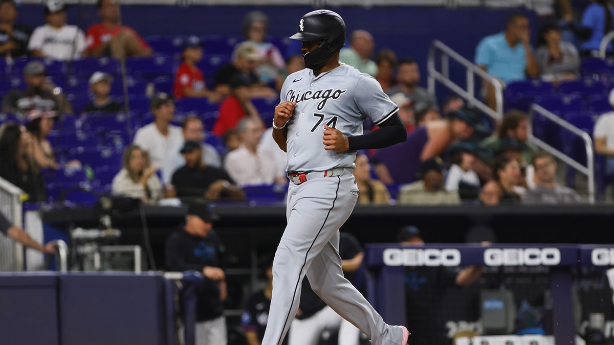 Jul 5, 2024; Miami, Florida, USA; Chicago White Sox designated hitter Eloy Jimenez (74) scores against the Miami Marlins during the fifth inning at loanDepot Park. Mandatory Credit: Sam Navarro-USA TODAY Sports