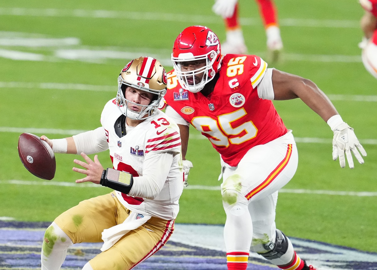 San Francisco 49ers quarterback Brock Purdy (13) is pressured by Kansas City Chiefs defensive tackle Chris Jones (95) in the second half in Super Bowl LVIII at Allegiant Stadium. 