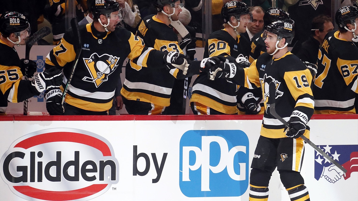 Pittsburgh Penguins right wing Reilly Smith (19) celebrates with the Pens bench after scoring a goal against the Minnesota Wild during the first period at PPG Paints Arena.