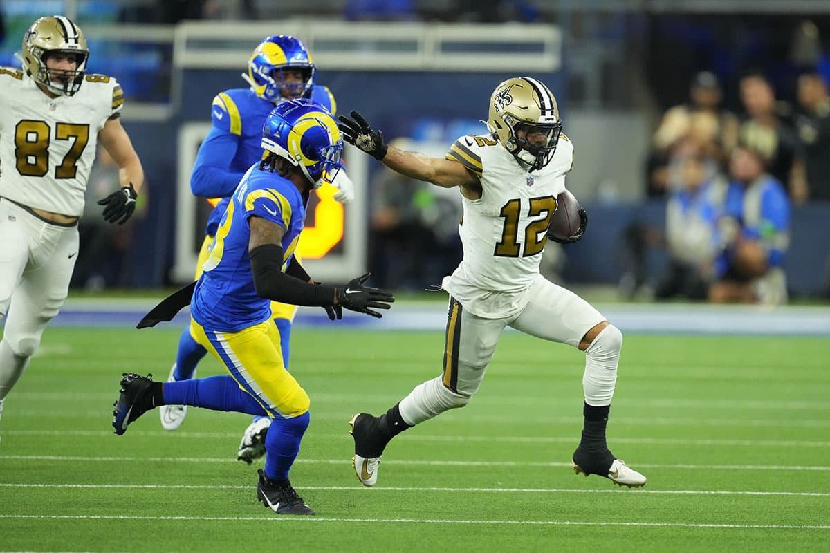 New Orleans Saints wide receiver Chris Olave (12) carries the ball against the Los Angeles Rams in the second half at SoFi Stadium. 
