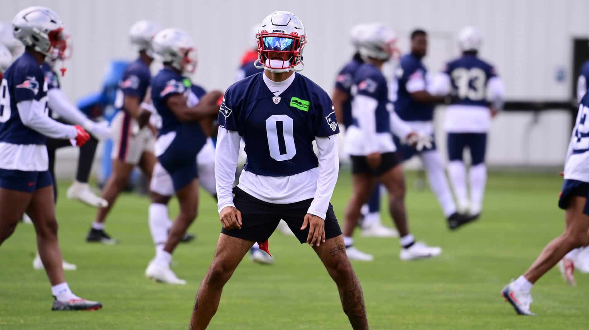 New England Patriots cornerback Christian Gonzalez (0) works out at minicamp at Gillette Stadium.