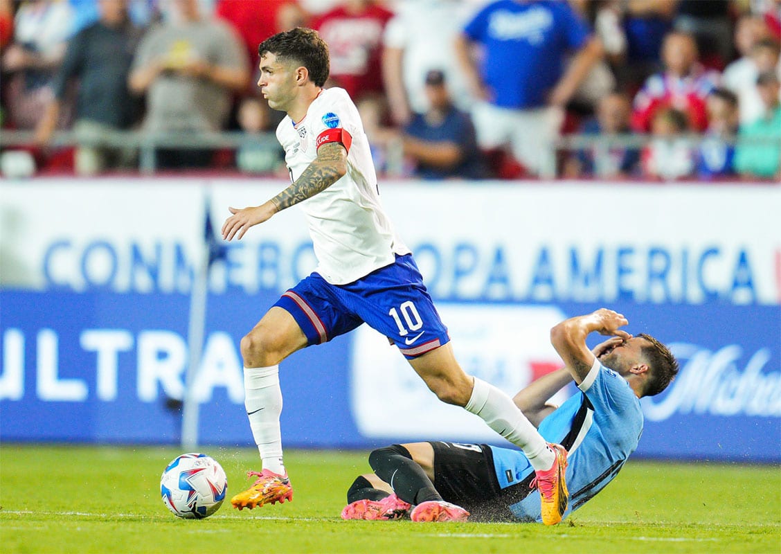 United States forward Christian Pulisic (10) controls the ball against Uruguay defender Matias Vina (17) during the second half of a Copa America match at Arrowhead Stadium. 