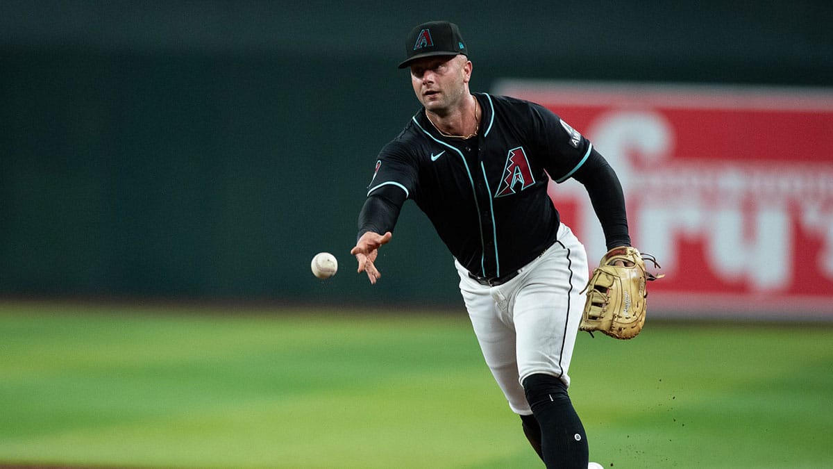 Arizona Diamondbacks first baseman Christian Walker (53) tosses the ball to first after fielding a sharp ground ball on July 27, 2024 at Chase Field in Phoenix.