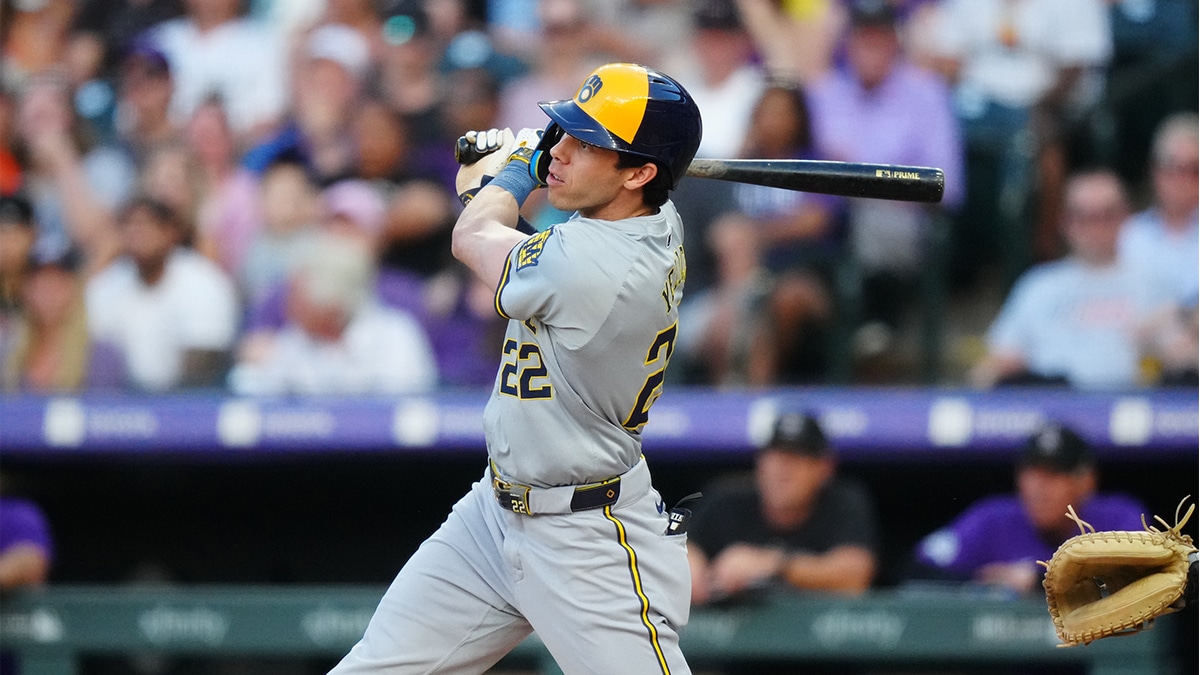 Jul 2, 2024; Denver, Colorado, USA; Milwaukee Brewers outfielder Christian Yelich (22) doubles in the third inning against the Colorado Rockies at Coors Field. 