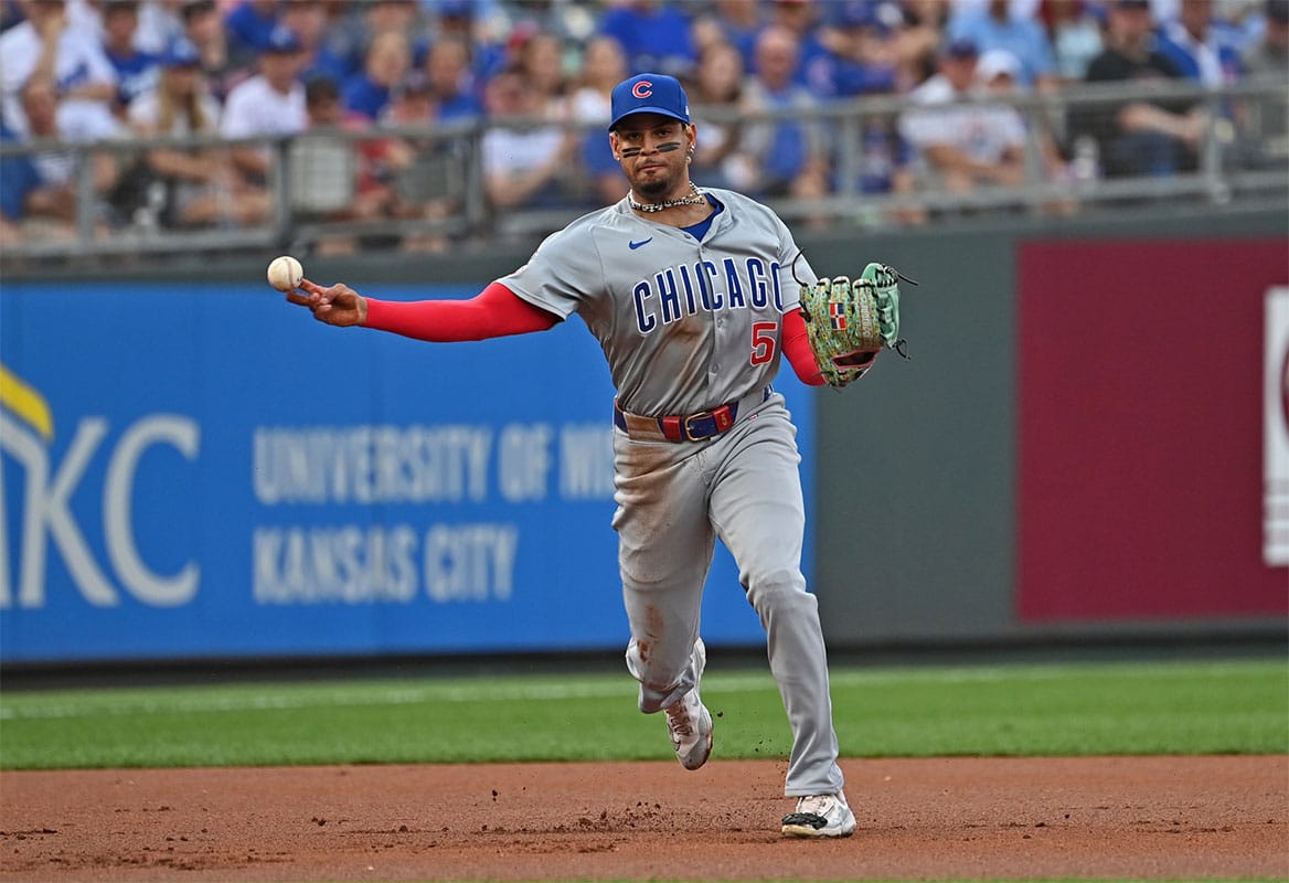 Chicago Cubs third baseman Christopher Morel (5) throws to first base for an out against the Kansas City Royals in the first inning at Kauffman Stadium.