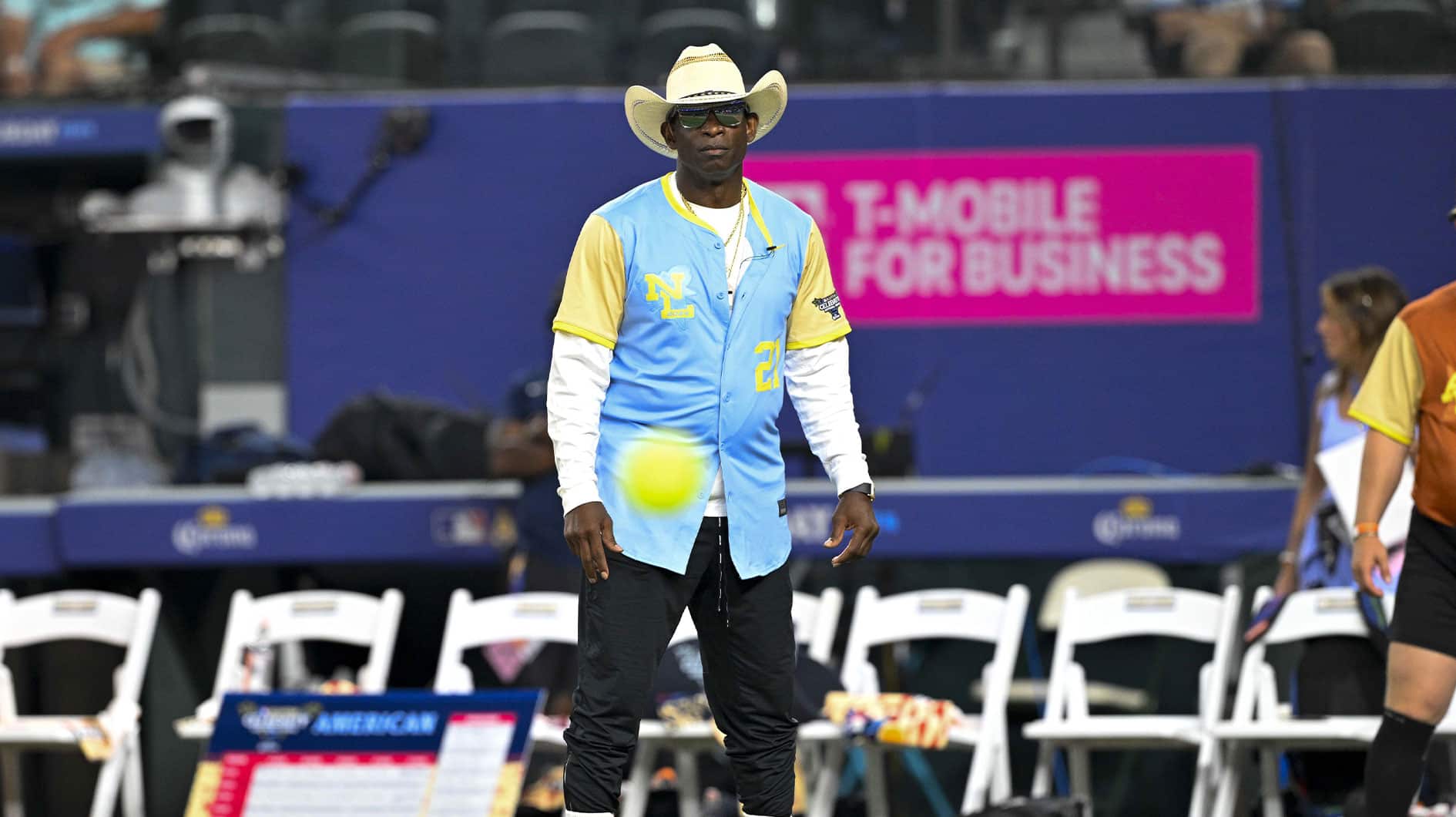 Jul 13, 2024; Arlington, TX, USA; Colorado Buffalos head coach and former MLB and NFL player Deion Sanders (21) of the National League watches the ball in play during the 2024 All Star Celebrity Softball Game at Globe Life Field. Mandatory Credit: Jerome Miron-USA TODAY Sports