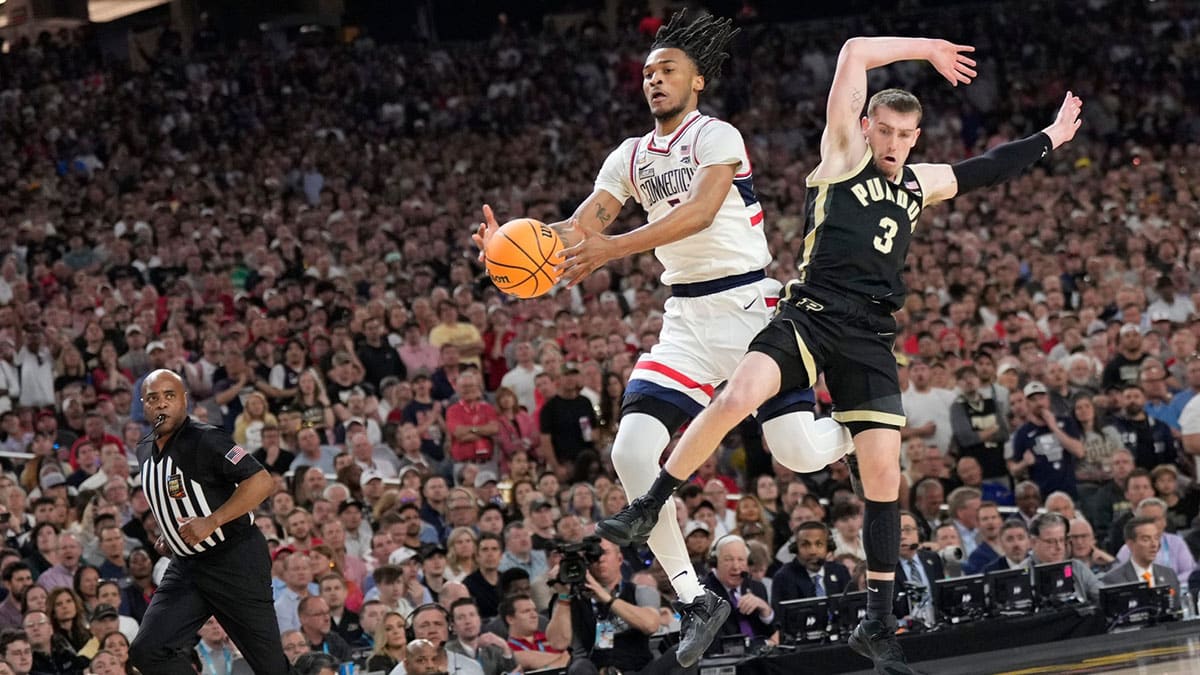 Connecticut Huskies guard Stephon Castle (5) collides with Purdue Boilermakers guard Braden Smith (3)