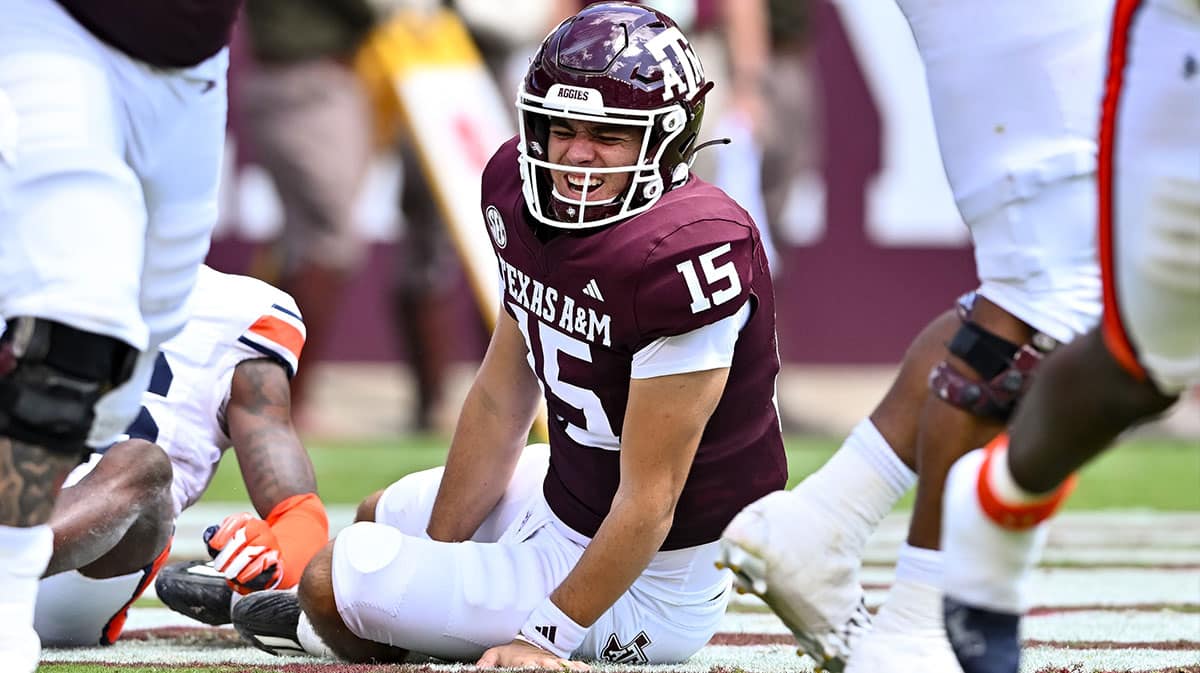 Texas A&M Aggies quarterback Conner Weigman (15) treacts after getting hit during the second quarter against the Auburn Tigers at Kyle Field.