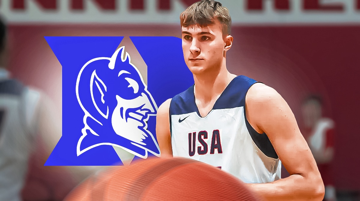 Cooper Flagg stands next to Duke basketball logo in Team USA Olympic gear