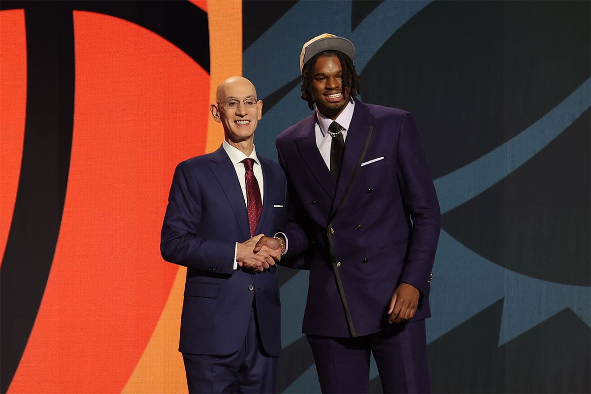 DaRon Holmes ll poses for photos with NBA commissioner Adam Silver after being selected in the first round by the Phoenix Suns in the 2024 NBA Draft at Barclays Center.