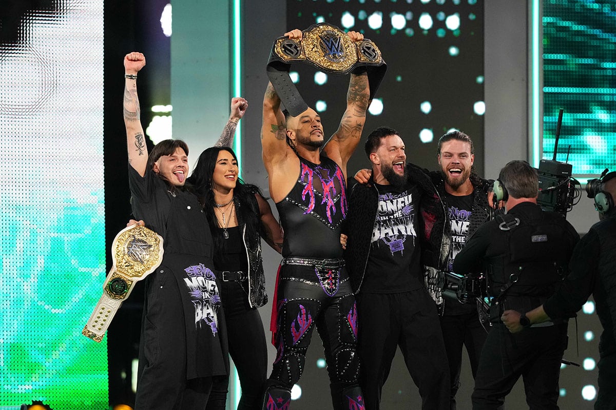 Dominik Mysterio, Rhea Ripley, Finn Bálor, and JD McDonagh celebrating Damian Priest at WrestleMania XL.