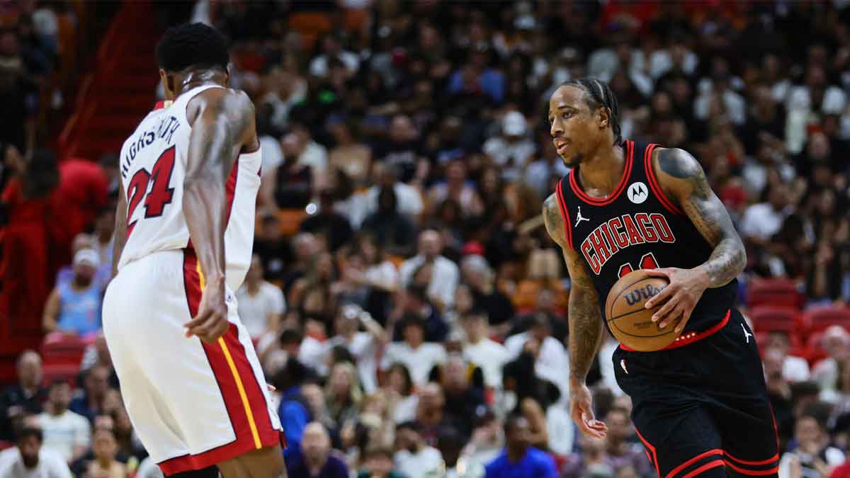 Chicago Bulls forward DeMar DeRozan (11) dribbles the basketball against the Miami Heat in the second quarter during a play-in game of the 2024 NBA playoffs at Kaseya Center.