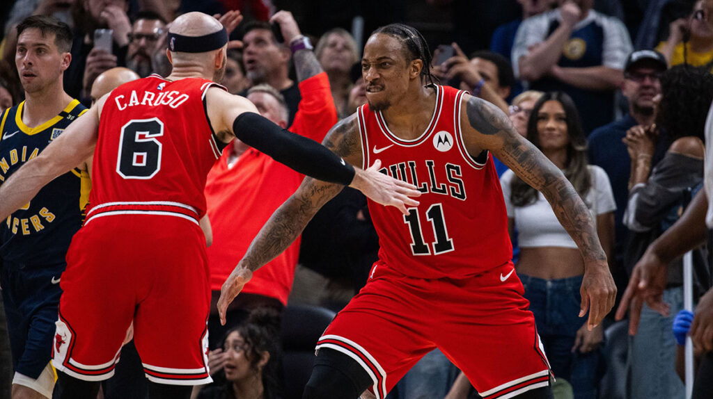 Chicago Bulls forward DeMar DeRozan (11) and guard Alex Caruso (6) celebrate a basket to tie the game and go to overtime against the Indiana Pacers at Gainbridge Fieldhouse.