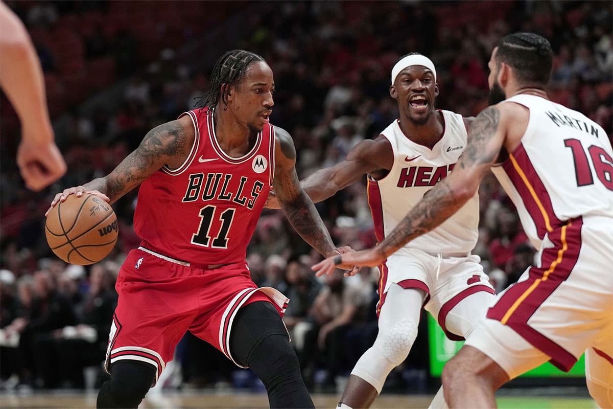 Chicago Bulls forward DeMar DeRozan (11) drives toward the basket as Miami Heat forward Caleb Martin (16) defends during the first half at Kaseya Center.