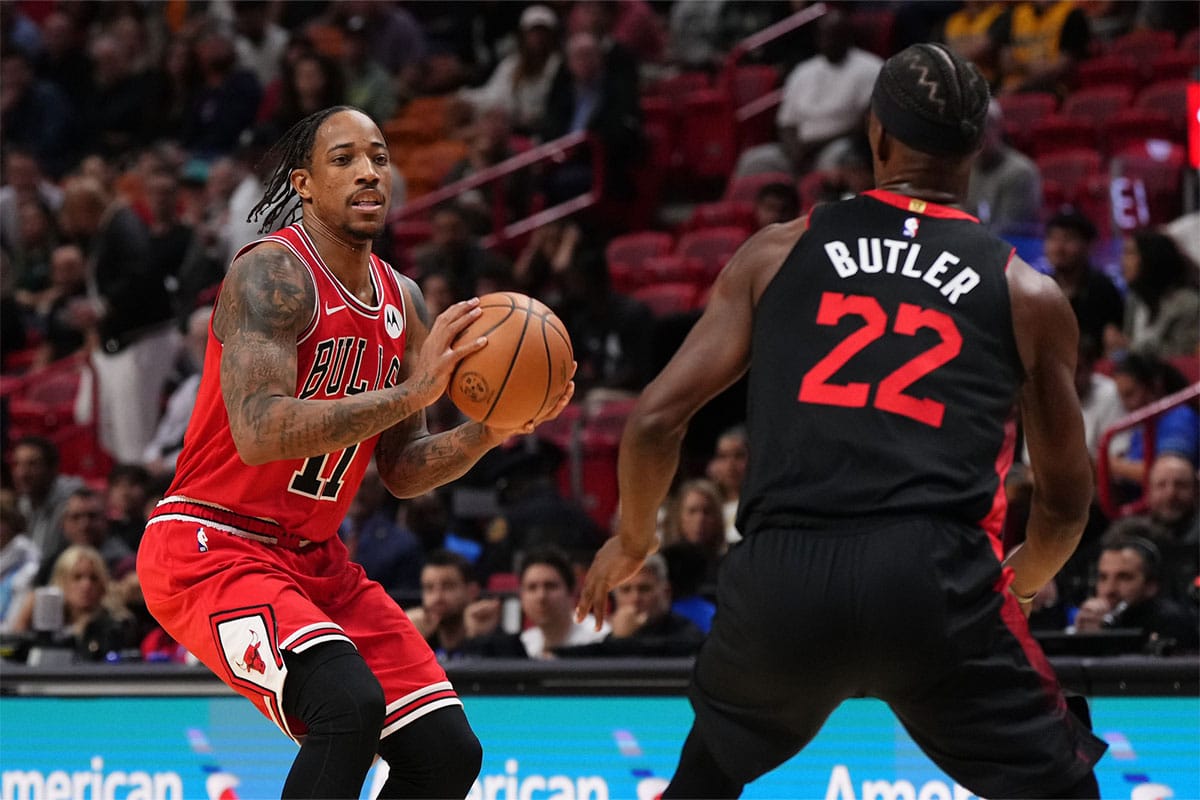 Chicago Bulls forward DeMar DeRozan (11) passes the ball away from Miami Heat forward Jimmy Butler (22) during the first half at Kaseya Center