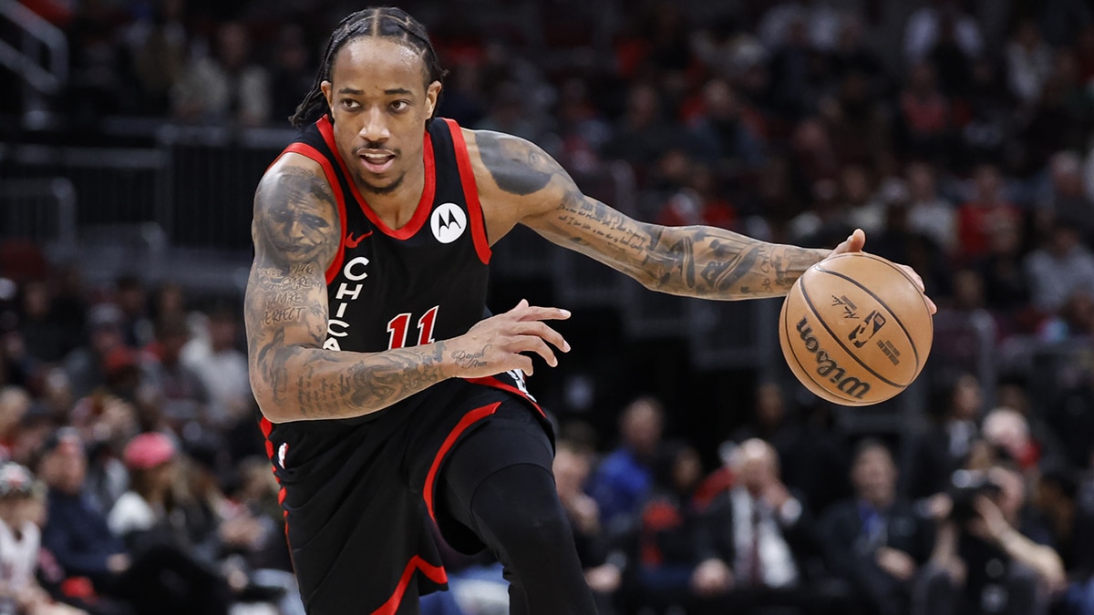 Chicago Bulls forward DeMar DeRozan (11) brings the ball up court against the Atlanta Hawks during the first half at United Center.