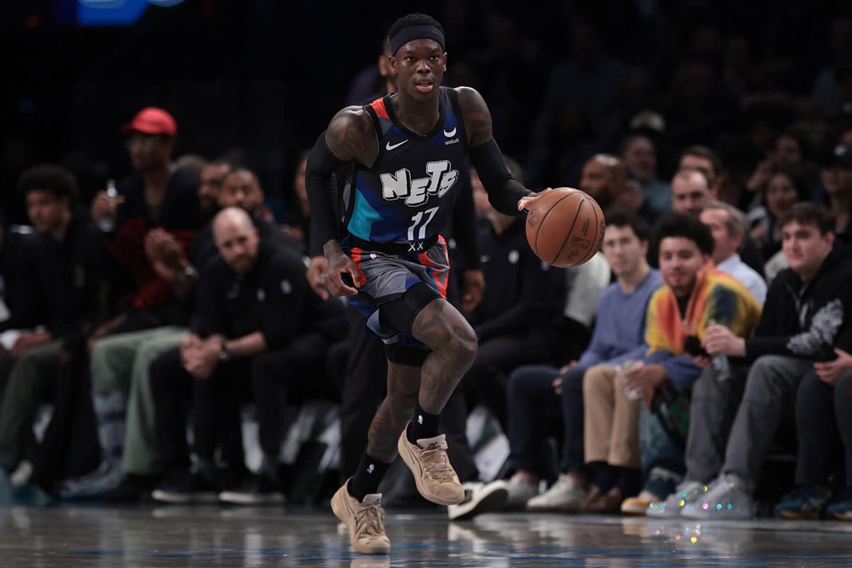 Brooklyn Nets guard Dennis Schroder (17) dribbles up court against the Sacramento Kings during the second half at Barclays Center. 