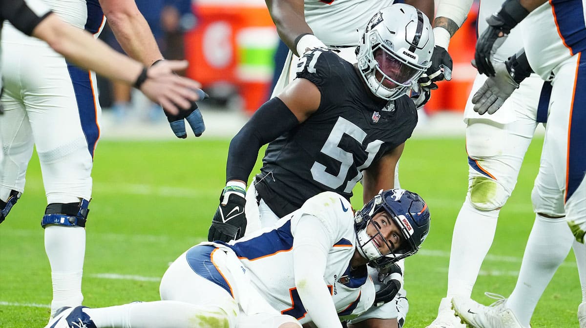 Denver Broncos quarterback Jarrett Stidham (4) reacts after being knocked down by Las Vegas Raiders defensive end Malcolm Koonce (51) during the second quarter at Allegiant Stadium.