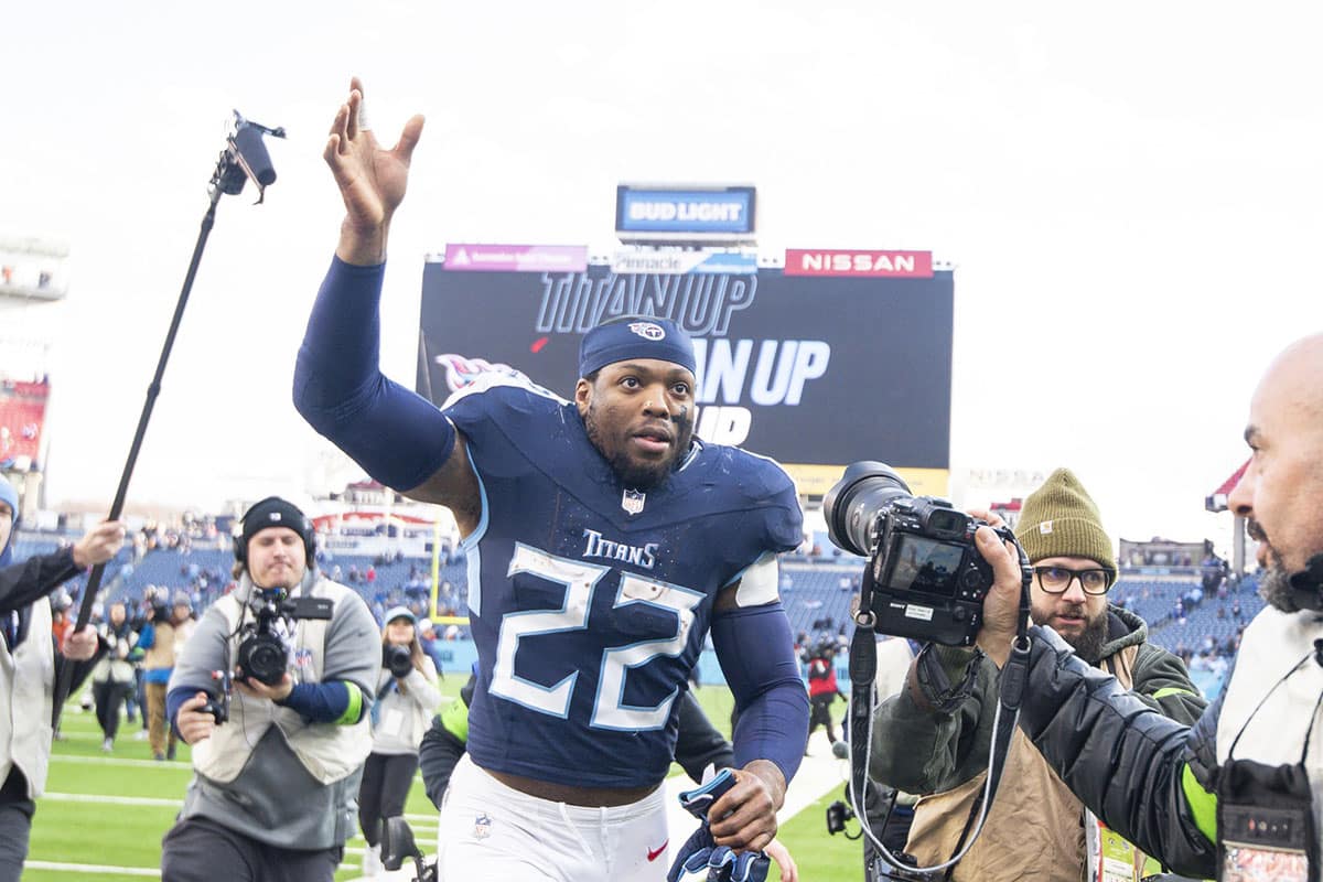 Tennessee Titans running back Derrick Henry (22) waves to the fans as he leaves the field against the Jacksonville Jaguars during the second half at Nissan Stadium.
