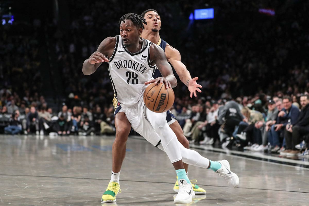 Brooklyn Nets forward Dorian Finney-Smith (28) drives past New Orleans Pelicans guard Trey Murphy III (25) in the third quarter at Barclays Center. 