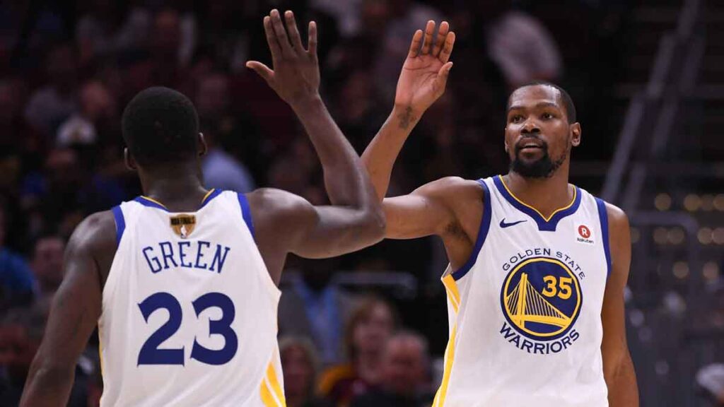 Golden State Warriors forward Kevin Durant (35) celebrates with forward Draymond Green (23) during the fourth quarter in game four of the 2018 NBA Finals against the Cleveland Cavaliers at Quicken Loans Arena. The Warriors defeated the Cavaliers 108-85 to complete a four-game sweep. 