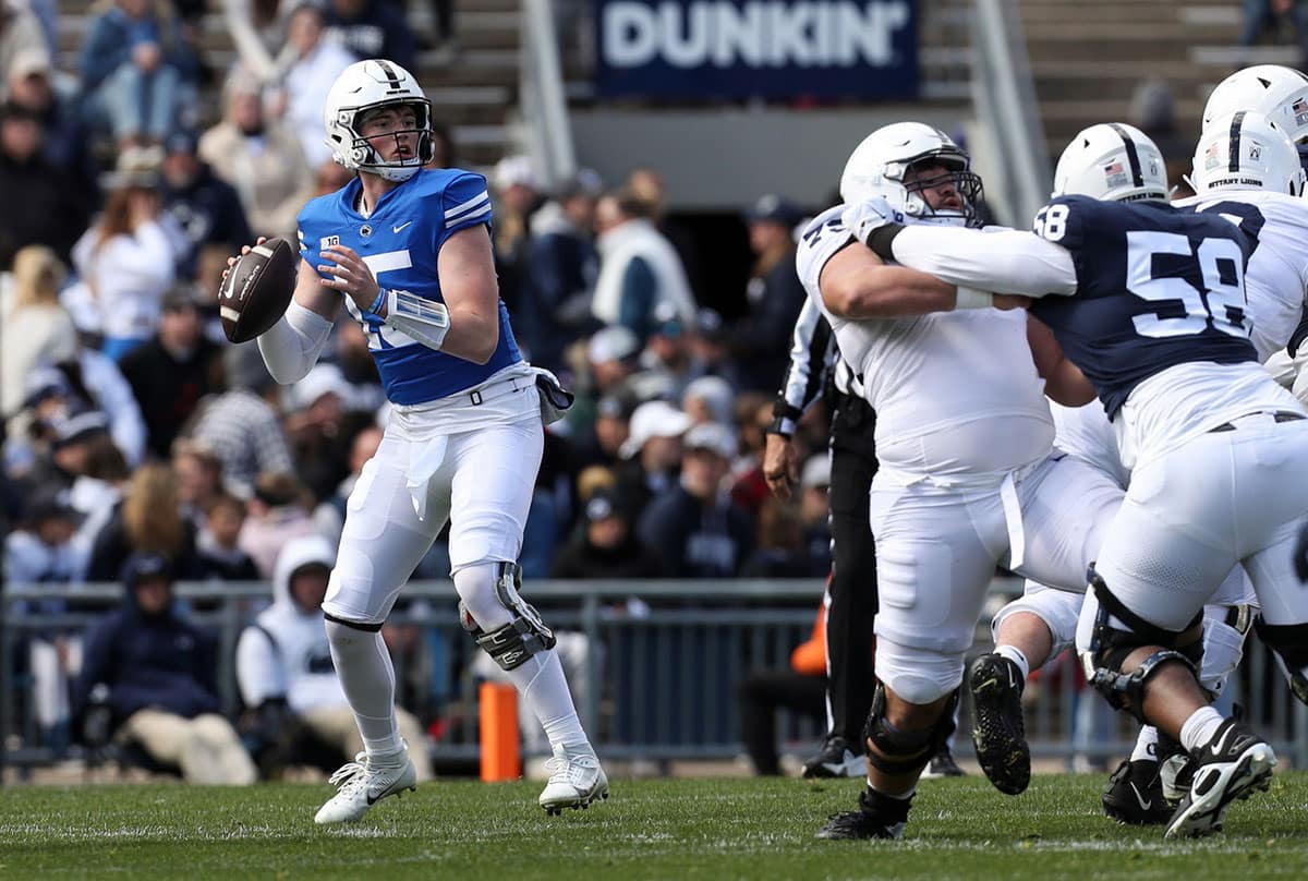 Penn State Nittany Lions quarterback Drew Allar (15) drops back and looks to throw a pass during the fourth quarter of the Blue White spring game at Beaver Stadium. The White team defeated the Blue team 27-0. 