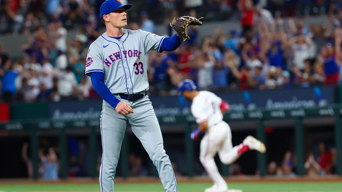 New York Mets relief pitcher Drew Smith (33) reacts as Texas Rangers center fielder Leody Taveras (3) runs the bases after hitting a two-run home run during the seventh inning at Globe Life Field.