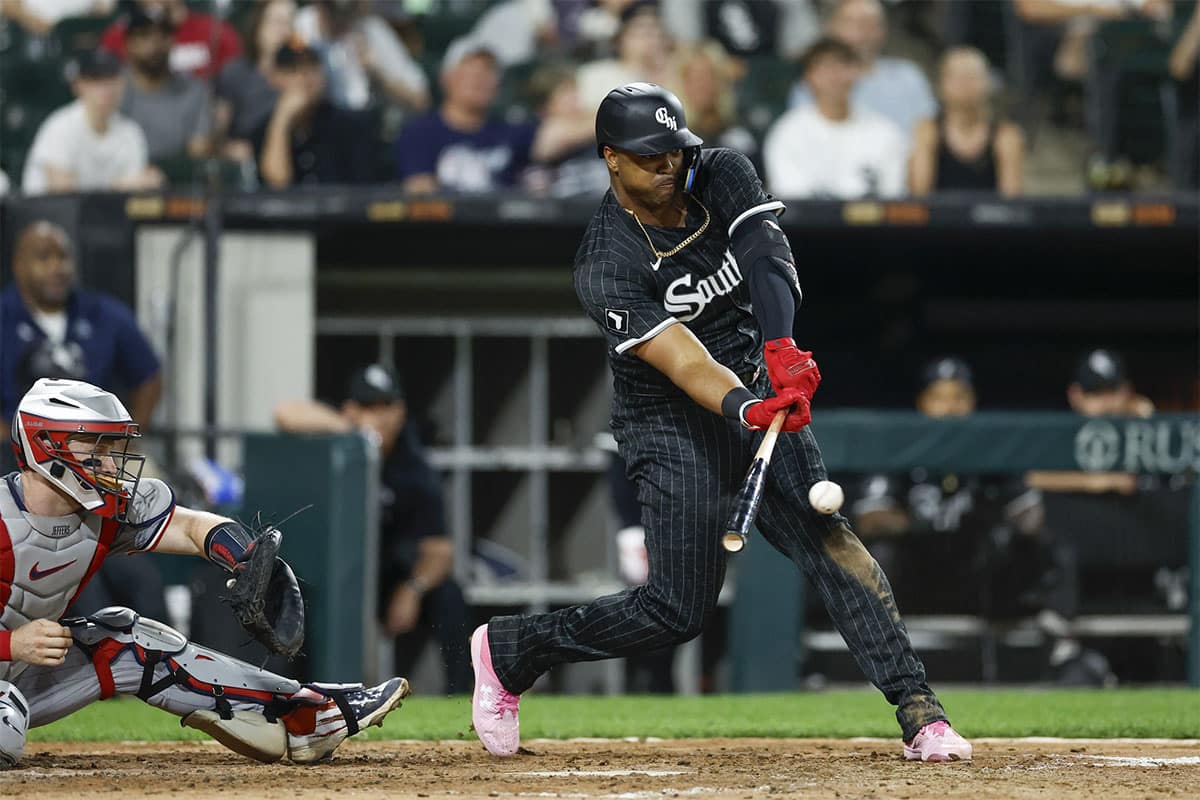 Chicago White Sox designated hitter Eloy Jimenez (74) hits an RBI-single against the Minnesota Twins during the sixth inning at Guaranteed Rate Field.