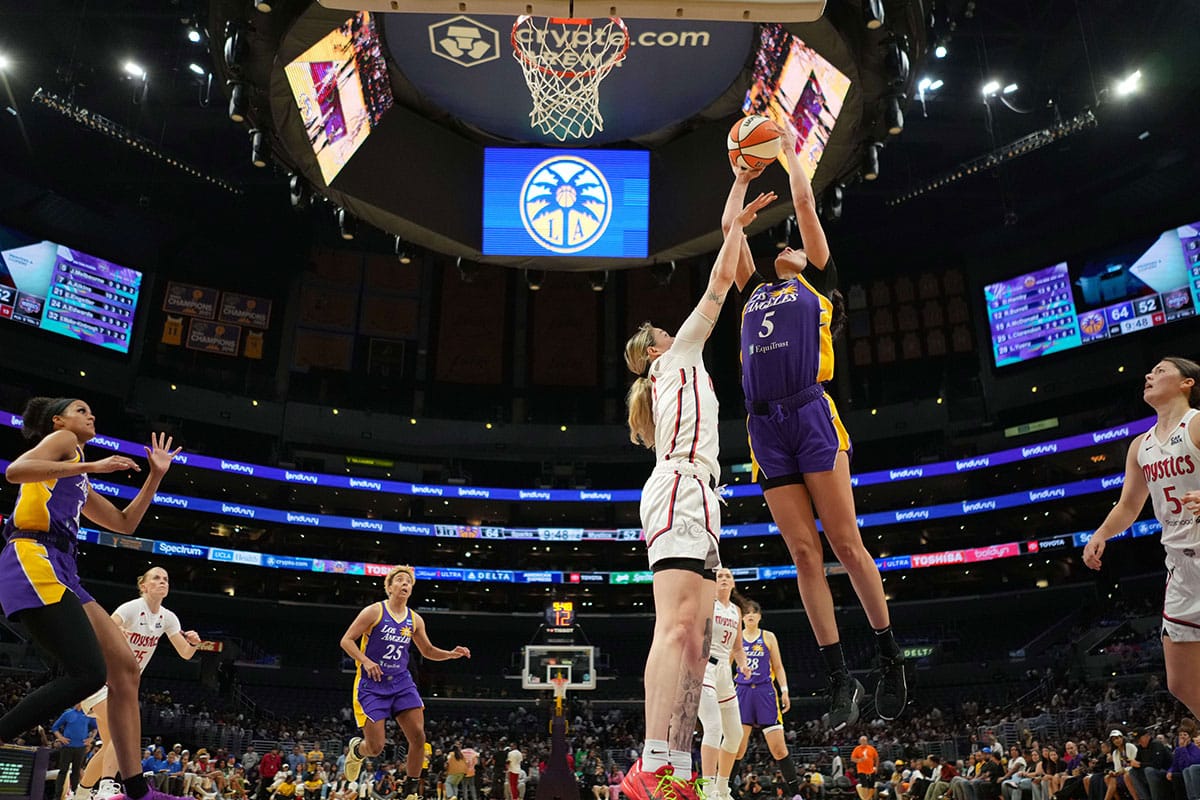 LA Sparks forward Dearica Hamby (5) shoots the ball against Washington Mystics forward Emily Engstler (21) in the second half at Crypto.com Arena.