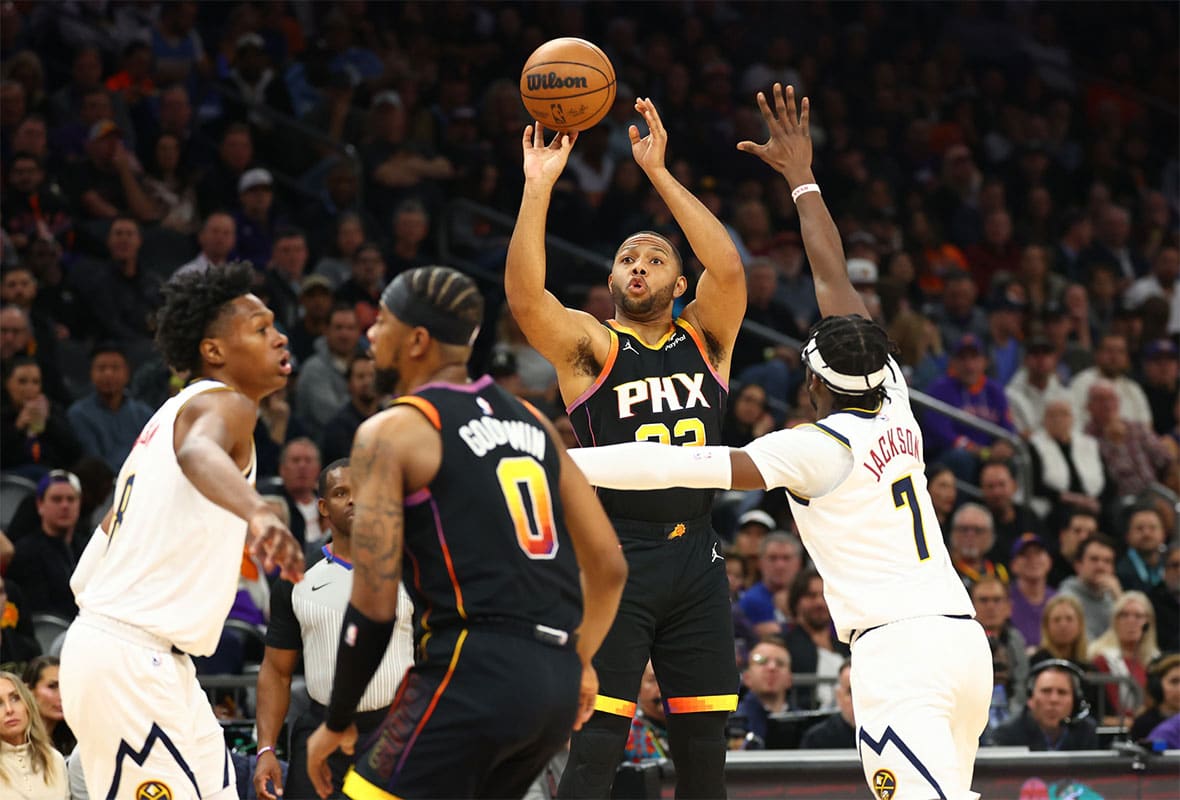 Phoenix Suns guard Eric Gordon shoots the ball against the Denver Nuggets in the first half at Footprint Center. 