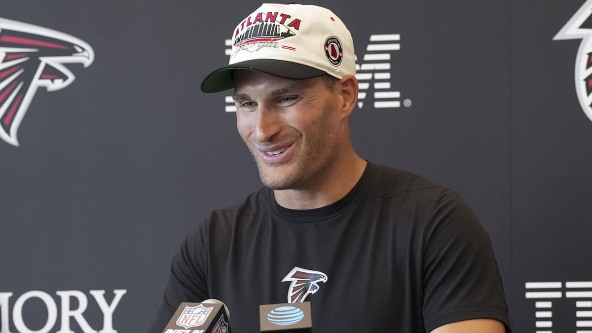 Atlanta Falcons quarterback Kirk Cousins (18) talks to the media on the first day of training camp at Falcons Training Camp.