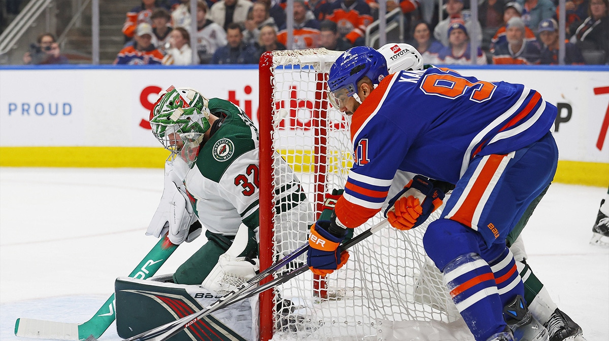 Edmonton Oilers forward Evander Kane (91) tries to jam a puck past Minnesota Wild goaltender Filip Gustavsson (32) during the third period at Rogers Place.