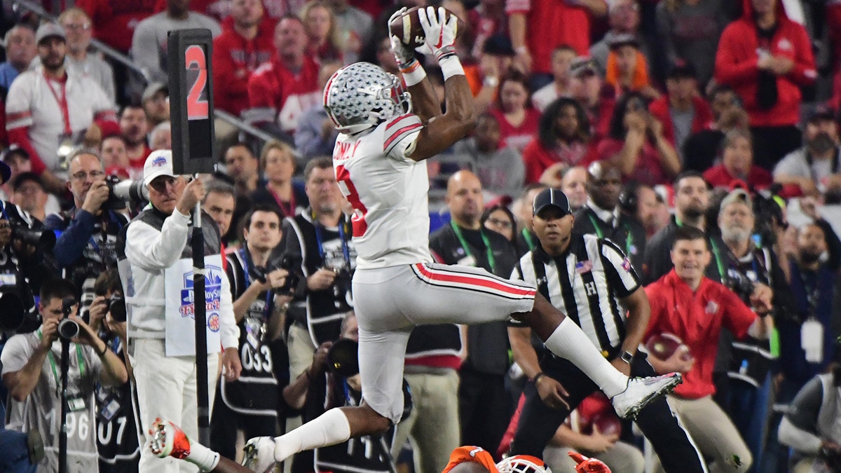 Ohio State cornerback Gareon Conley (8) intercepts a pass intended for Clemson wide receiver Mike Williams (bottom) during the first quarter in the 2016 CFP semifinal at University of Phoenix Stadium. 