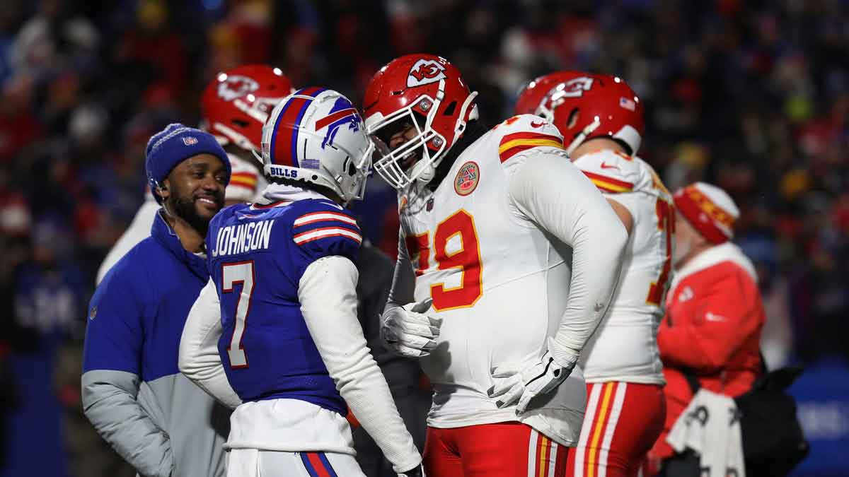 Bills cornerback Taron Johnson and Chiefs left tackle Donovan Smith have a laugh during a t.v. timeout in the second half of the Bills divisional game against Kansas City Chiefs at Highmark Stadium in Orchard Park.