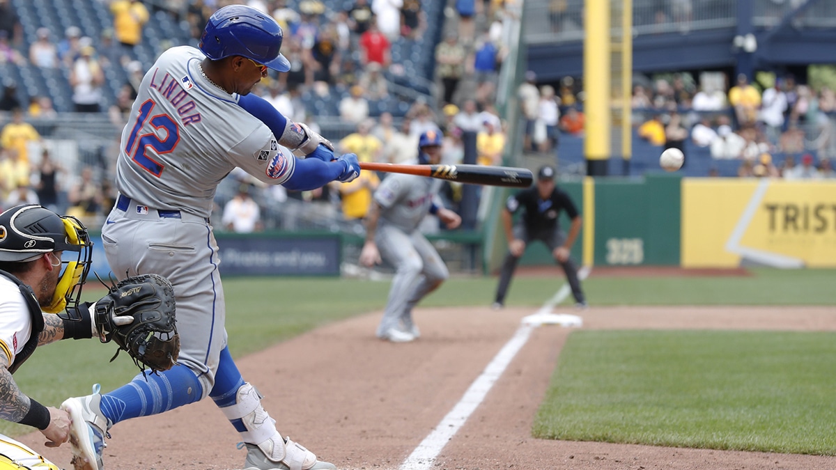 New York Mets shortstop Francisco Lindor (12) hits a game winning two run single against the Pittsburgh Pirates during the ninth inning at PNC Park. The Mets won 3-2.