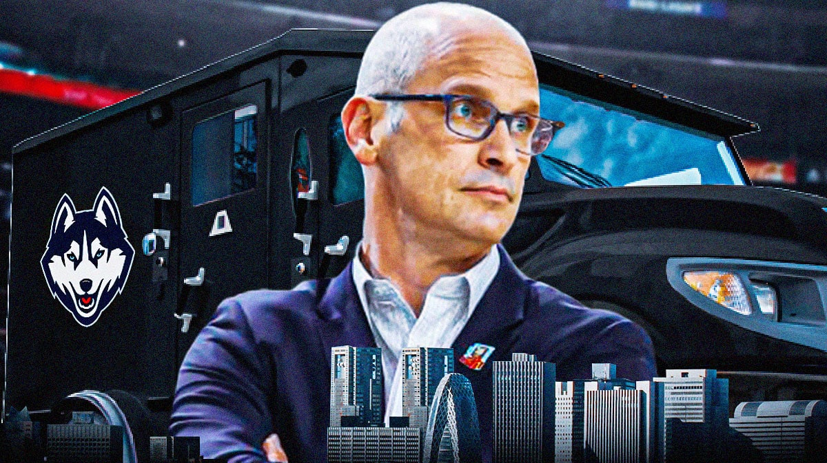 UConn Huskies head coach Dan Hurley in front of a Brink's Truck