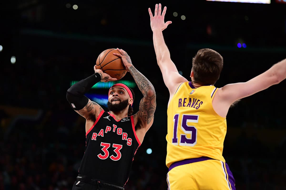 Toronto Raptors guard Gary Trent Jr. (33) shoots against Los Angeles Lakers guard Austin Reaves (15) during the first half at Crypto.com Arena.