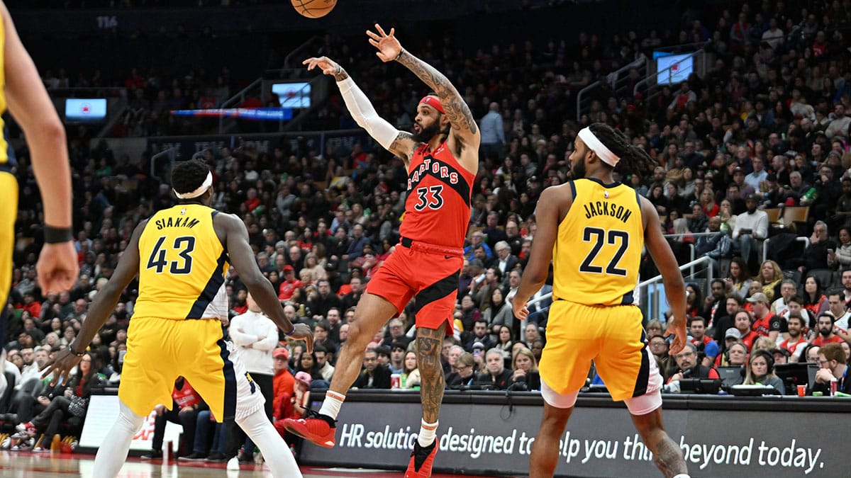 Toronto Raptors guard Gary Trent Jr. (33) passes the ball away from Indiana Pacers forwards Pascal Siakam (43) and Isaiah Jackson (22) in the first half at Scotiabank Arena.