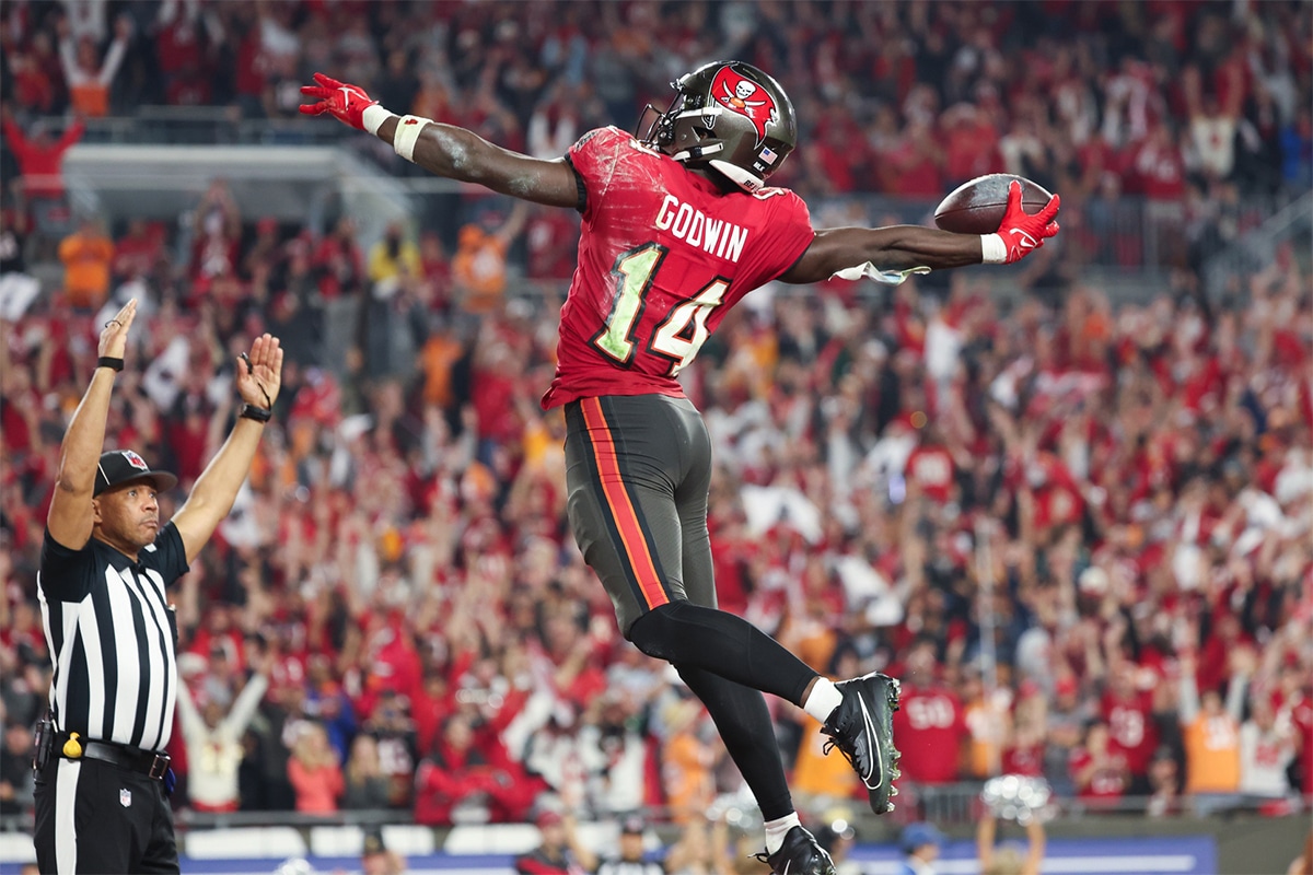 Tampa Bay Buccaneers wide receiver Chris Godwin (14) celebrates his touchdown against the Philadelphia Eagles during the second half of a 2024 NFC wild card game at Raymond James Stadium.