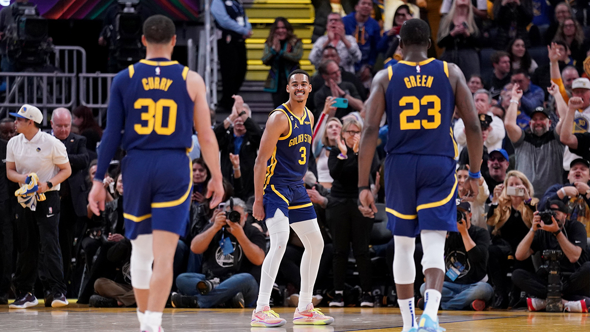 Apr 4, 2023; San Francisco, California, USA; Golden State Warriors guard Jordan Poole (3) reacts in front of guard Stephen Curry (30) and forward Draymond Green (23) after making a three point basket against the Oklahoma City Thunder in the fourth quarter at the Chase Center. Mandatory Credit: Cary Edmondson-USA TODAY Sports