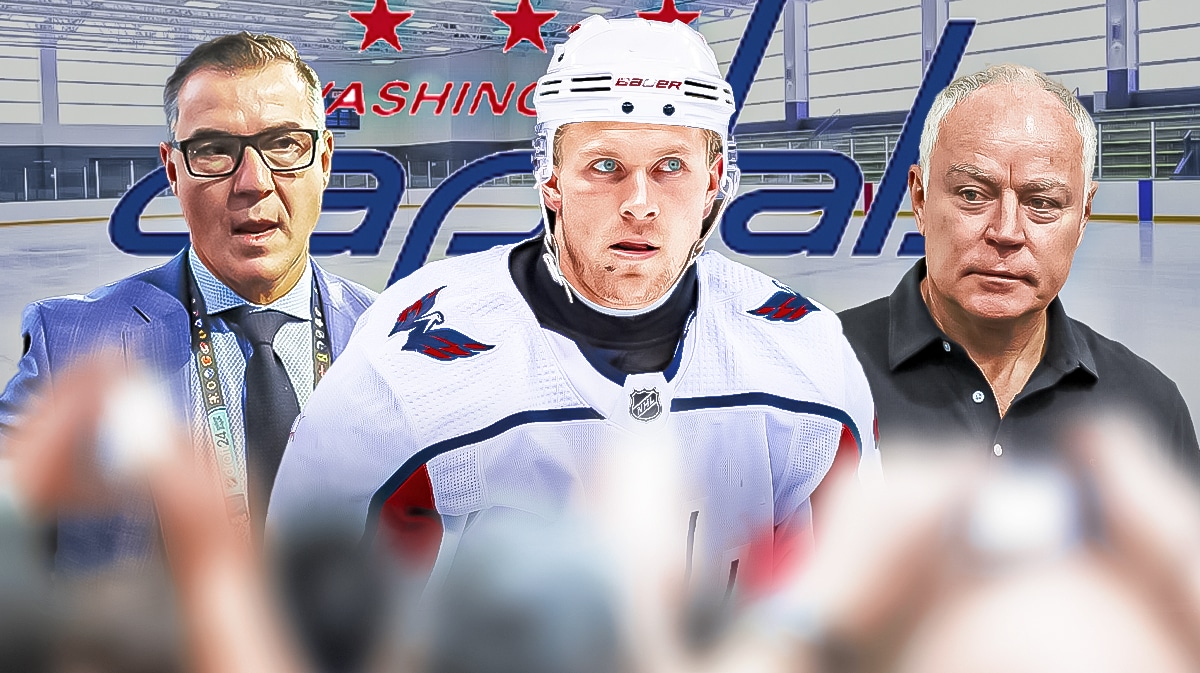 Jakob Chychrun in the middle in a Washington Capitals jersey. Steve Staios on one side and Brian MacLellan on the other side. Washington Capitals logo and ice rink in background.