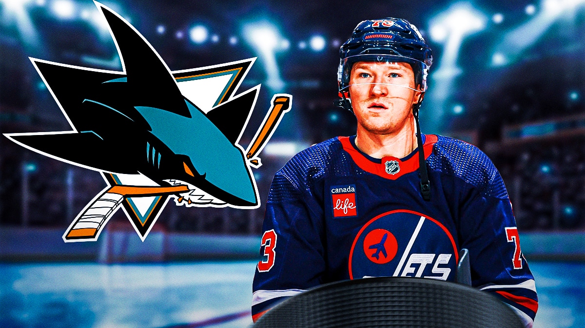 Tyler Toffoli in image looking happy, San Jose Sharks logo, hockey rink in background