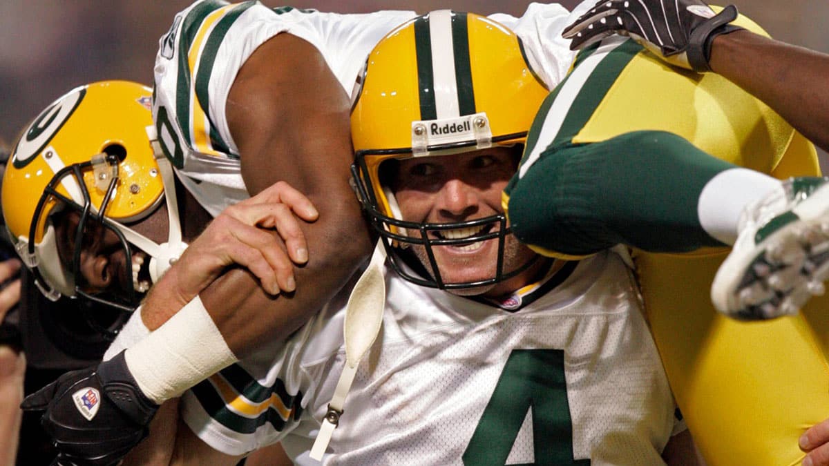 After breaking the NFL record for career touchdown passes, Green Bay Packers quarterback Brett Favre hoists its recipient, Greg Jennings, during the first quarter of their game against the Minnesota Vikings Sunday, September 30, 2007 at the Metrodome in Minneapolis, Minn. Favre's 421st touchdown pass eclipsed Dan Marino's record.