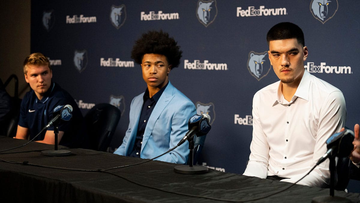 Grizzlies 2024 NBA Draft picks Cam Spencer, Jaylen Wells, and Zach Edey listen during a press conference to introduce the team’s picks at FedExForum on Friday, June 28, 2024.