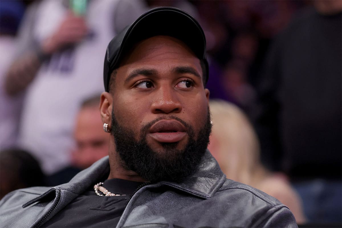 New York Jets linebacker Haason Reddick sits court side during the fourth quarter between the New York Knicks and the Sacramento Kings at Madison Square Garden.