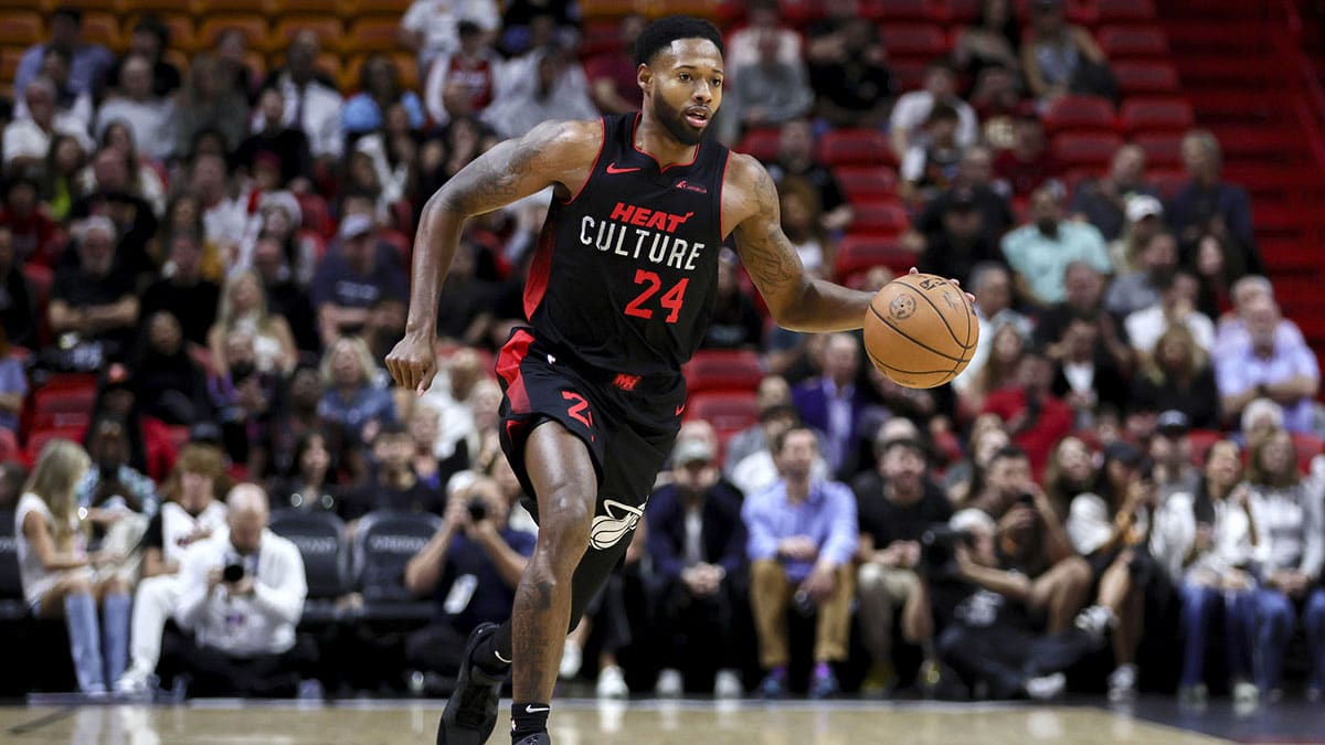 Miami Heat forward Haywood Highsmith (24) dribbles the basketball against the Memphis Grizzlies during the first quarter at Kaseya Center.