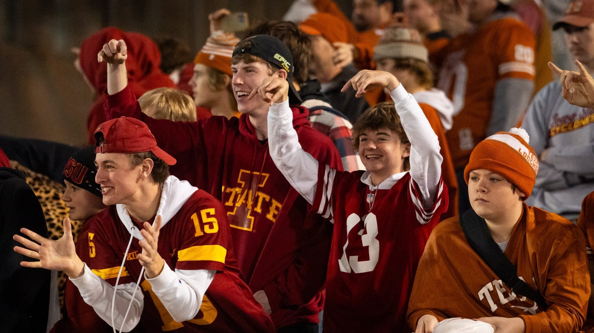 Iowa State fans show the \"horns down\" as Texas head back to the locker room after warming up ahead of the Longhorns' game against the Cyclones