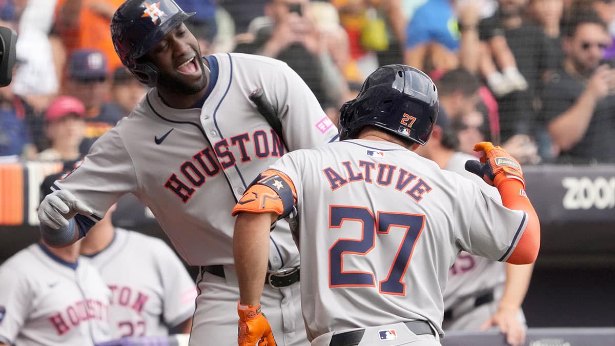 Houston Astros second baseman Jose Altuve (27) celebrates with designated hitter Yordan Alvarez (44) after hitting a home run in the third inning against the Colorado Rockies during the MLB World Tour Mexico City Series game at Estadio Alfredo Harp Helu