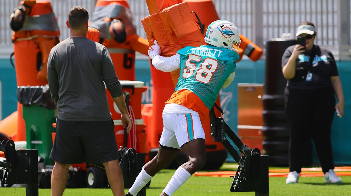 Miami Dolphins linebacker Shaquil Barrett (58) works out during mandatory minicamp at Baptist Health Training Complex